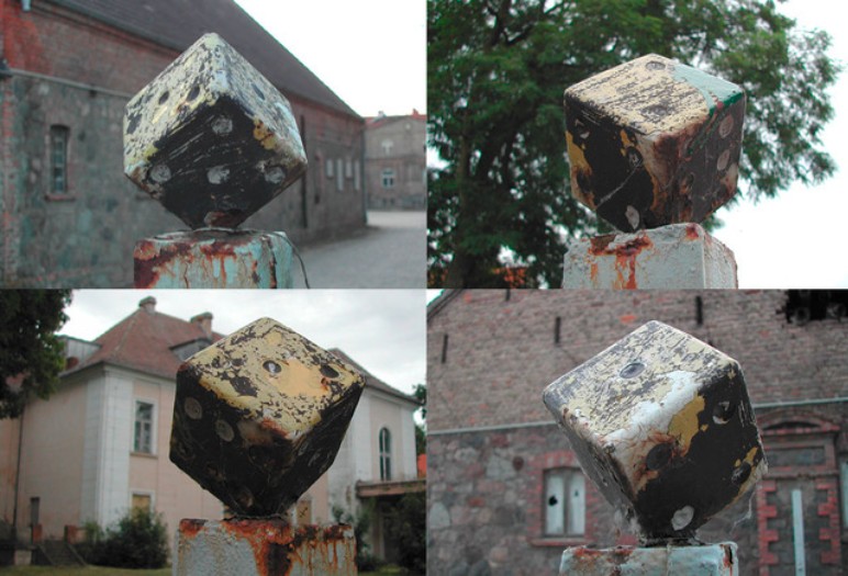 Eine Collage von vier Fotos einer Skulptur, die einen Würfel darstellt